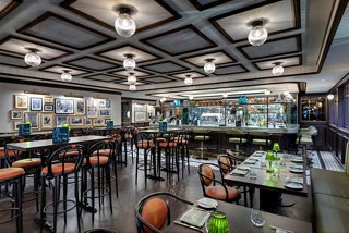 L'Atelier Bistrot features a stylish setting with a bar counter and inviting seating | MSC Cruises