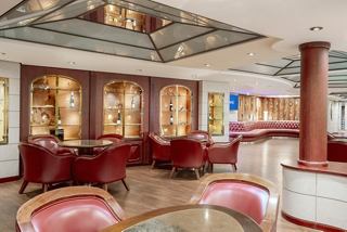 L'Enoteca Wine Bar on MSC Musica features inviting seating and elegant décor for guests | MSC Cruises