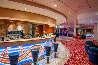 L'Incontro Bar on MSC Orchestra featuring a welcoming bar counter and inviting seating area | MSC Cruises