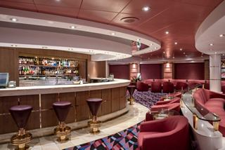 A modern bar with comfortable seating and inviting atmosphere on MSC Opera | MSC Cruises