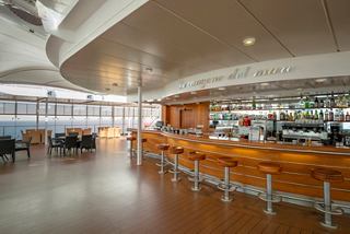 La Canzone Del Mare bar on MSC Lirica features inviting seating and a contemporary bar counter | MSC Cruises