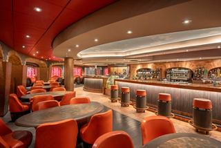 Bar with inviting armchairs and tables on board MSC Preziosa | MSC Cruises