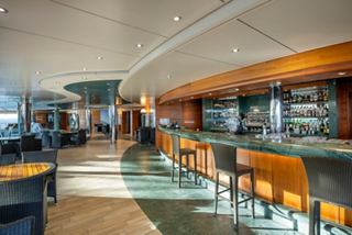 Bar and inviting seating area with modern chairs on MSC Preziosa | MSC Cruises