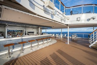 Marina Bar on MSC Seascape offers outdoor seating with panoramic ocean views | MSC Cruises