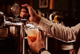 Close-up of a bartender pouring a beverage on MSC World Europa | MSC Cruises