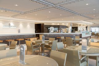 Miami Beach Bar on MSC Seaside featuring inviting seating and a stylish bar counter | MSC Cruises