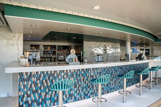 Rive Droite bar with inviting counter seating on MSC World Europa | MSC Cruises