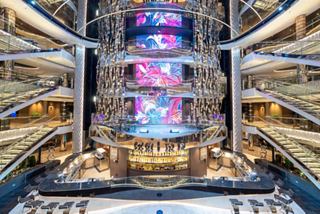 Atrium featuring a bar counter and stairs, surrounded by decks on MSC Seashore | MSC Cruises