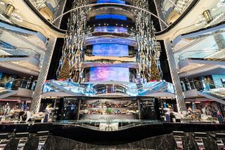 Atrium of MSC Seaside featuring LED screens and a stylish bar for guests to enjoy | MSC Cruises