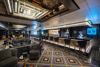 Bar and lounge area onboard MSC Seaview featuring inviting seating and elegant ambiance | MSC Cruises