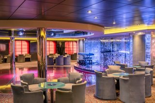 Sinfonia Lounge on MSC Sinfonia features a piano, seating areas and an inviting atmosphere | MSC Cruises