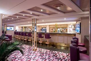 Sottovento Pub on MSC Opera features a welcoming bar counter and inviting seating | MSC Cruises