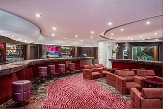 Bar with comfortable seating and tables on board MSC Splendida | MSC Cruises
