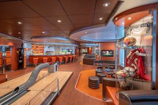 Sports bar featuring bowling lanes, comfortable seating areas and entertainment screens | MSC Cruises