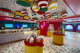 Sweet Temptations on MSC World Europa features vibrant décor and inviting seating areas for guests | MSC Cruises