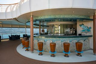 Tartaruga Bar on MSC Splendida welcomes guests with inviting seating and scenic sea views | MSC Cruises