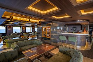 Spacious lounge with comfortable sofas and sea views, perfect for relaxing onboard | MSC Cruises
