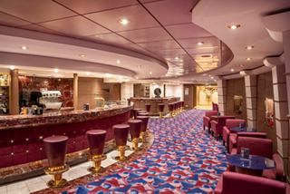 Bar with inviting seating and tables for relaxation and socializing on MSC Orchestra | MSC Cruises