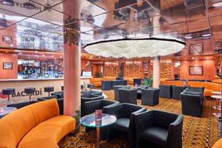 Inviting lounge area with comfortable seating and stylish lighting at The Red Bar | MSC Cruises