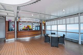 The Vitamin Bar offers seating and wide windows with a scenic view of the sea | MSC Cruises