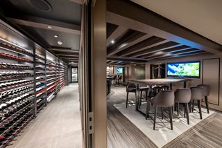 Contemporary wine cellar featuring tasting tables and bottle racks in a welcoming setting | MSC Cruises