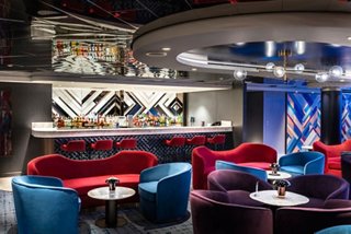 Uptown Lounge features vibrant seating and a sleek bar for social moments | MSC Cruises