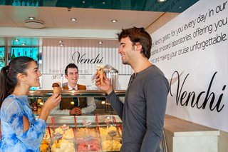 A couple enjoys ice cream at the Venchi bar aboard MSC Divina | MSC Cruises
