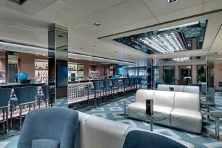 Contemporary bar with ample seating and inviting lounge space aboard MSC Seaside | MSC Cruises