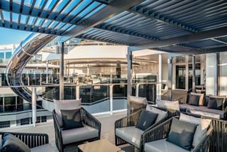 Inviting lounge and bar area with sea views aboard MSC World Europa | MSC Cruises