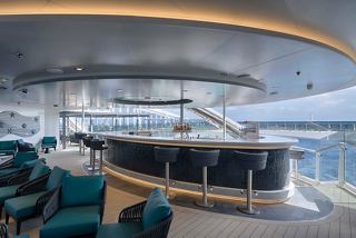 Modern bar with comfortable seating and sea view aboard MSC World America | MSC Cruises