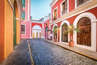 Vibrant street with stone pavement and colorful facades in San Juan, Puerto Rico | MSC Cruises