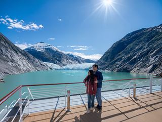 Couple enjoying a beautiful landscape on Alaska