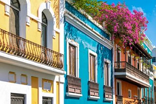 Colorful houses and a flower-filled balcony in San Juan, Puerto Rico | MSC Cruises