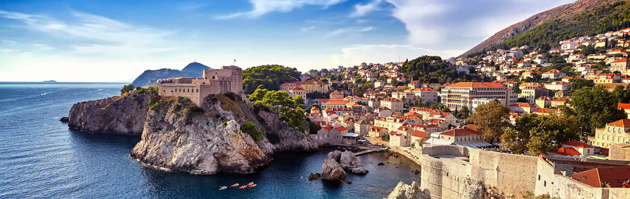 Colorful buildings and rocky coastline along the Adriatic in Croatia | MSC Cruises