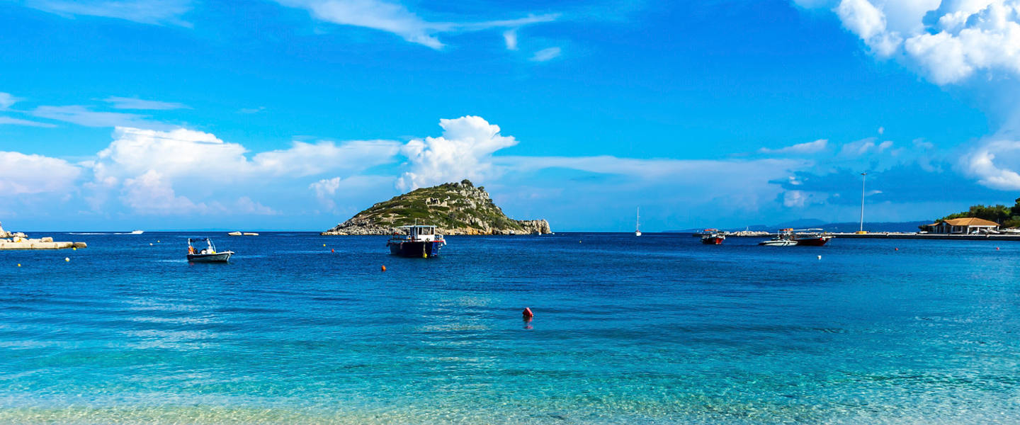 Sandy beach and turquoise sea near a Greek island in the Mediterranean | MSC Cruises
