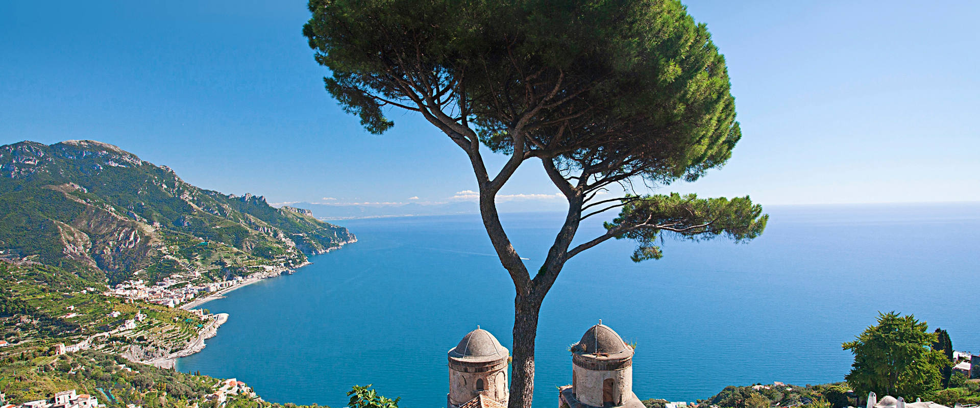 The Mediterranean coastline of Ravello, Italy with panoramic sea views and a tree | MSC Cruises