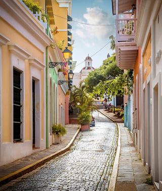 A vibrant street lined with buildings and trees in San Juan, Puerto Rico | MSC Cruises