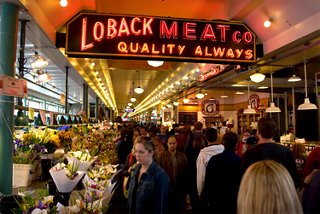 Guests explore the vibrant Seattle fish market filled with fresh seafood and local vendors | MSC Cruises