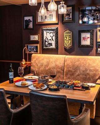 A table set with food and drinks in the Butcher's Cut specialty restaurant on MSC Seaside | MSC Cruises