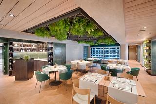 Eataly restaurant on MSC World America features spacious seating and vibrant greenery | MSC Cruises