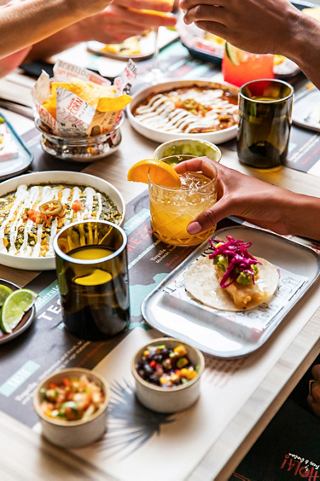 A variety of drinks and dishes on a table invite guests to share joyful moments | MSC Cruises