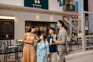 A family shares a joyful moment outside a restaurant on a cruise ship | MSC Cruises