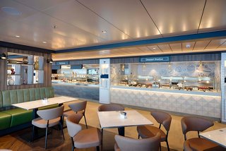 Welcoming buffet seating area with tables and chairs aboard MSC World Atlantic | MSC Cruises