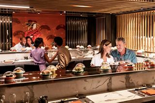 Guests share a memorable dining experience at a welcoming sushi restaurant onboard a cruise ship | MSC Cruises