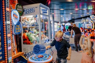 Children enjoy a vibrant arcade games area aboard a cruise ship | MSC Cruises