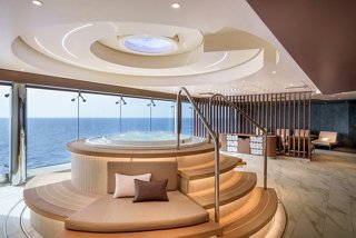 Spacious thermal area with whirlpool bath and panoramic sea views from large windows | MSC Cruises