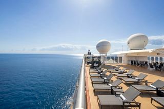 Aurea solarium with sunbeds and sweeping sea views aboard an MSC cruise ship | MSC Cruises