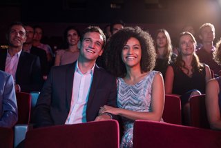 Guests enjoy entertainment in a welcoming theater setting | MSC Cruises