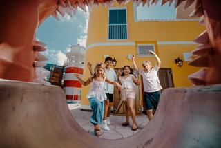 Children play joyfully on a colorful playground, full of smiles and energy | MSC Cruises