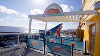 Outdoor spiral waterslide overlooking the sea offers excitement for guests onboard | MSC Cruises